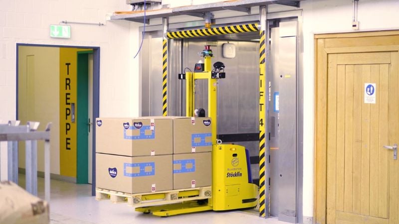 An automated forklift in an elevator