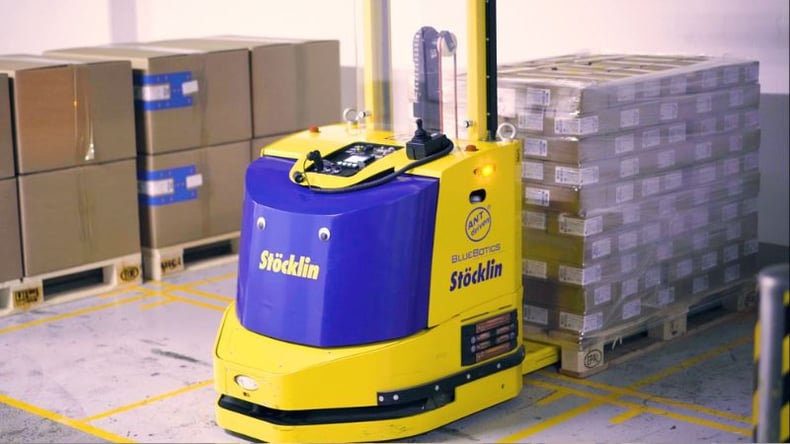 An automated forklift picks up a pallet